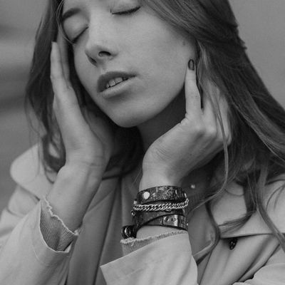 Closed eyes of a person meditating in soft light